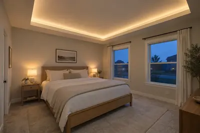 Bedroom concept showing a soft ceiling glow from concealed perimeter lighting